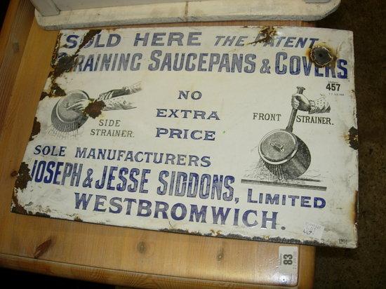 Appraisal: A WHITE ENAMEL ADVERTISING SIGN selling saucepans and covers at