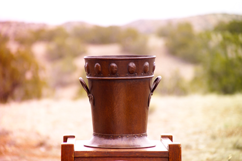 Appraisal: BENEDICT Hammered copper ice bucket with riveted spade-shaped handles below