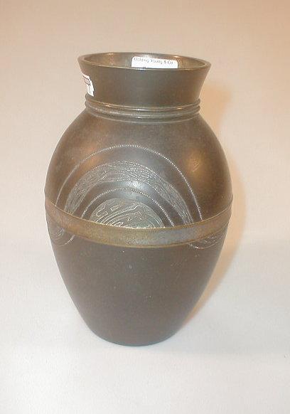 Appraisal: A Japanese bronze ovoid vase the body decorated with an