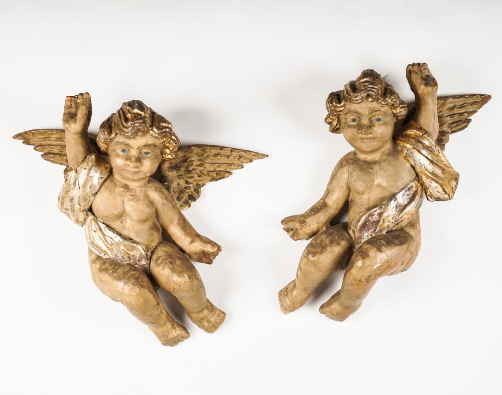 Appraisal: PAIR OF CARVED WOOD CHERUB FIGURESeach retaining traces of paint