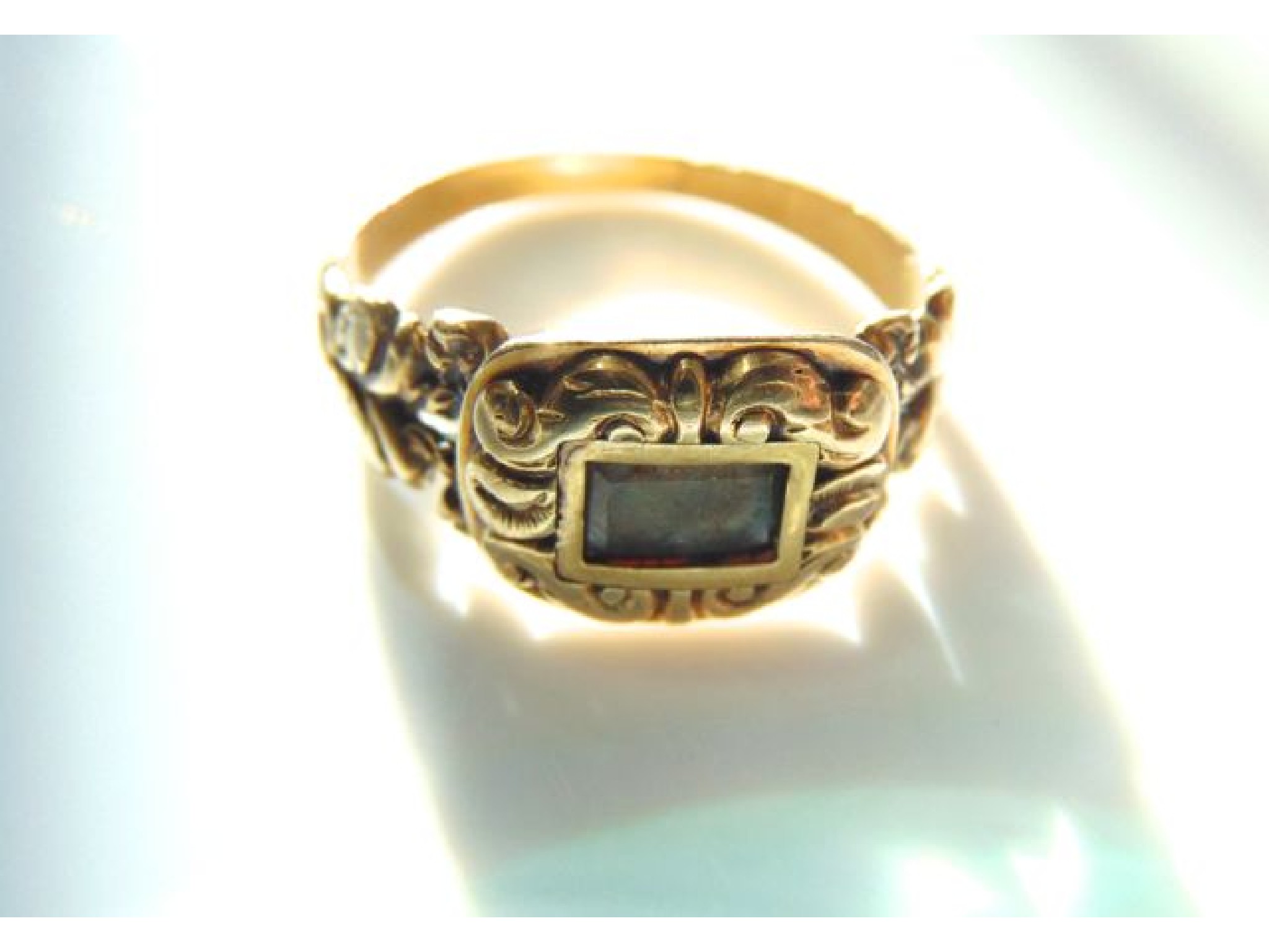 Appraisal: A Georgian hair mourning ring the central plaited hair panel