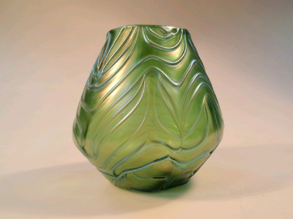 Appraisal: A Loetz style green glass vase of conical form with