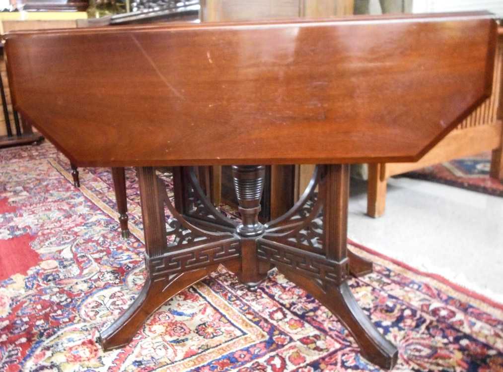 Appraisal: VICTORIAN WALNUT DROP-LEAF GAME TABLE Eastlake design American last quarter