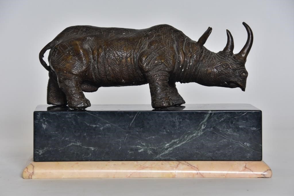 Appraisal: Bronze rhino sculpture th c resting on a marble base