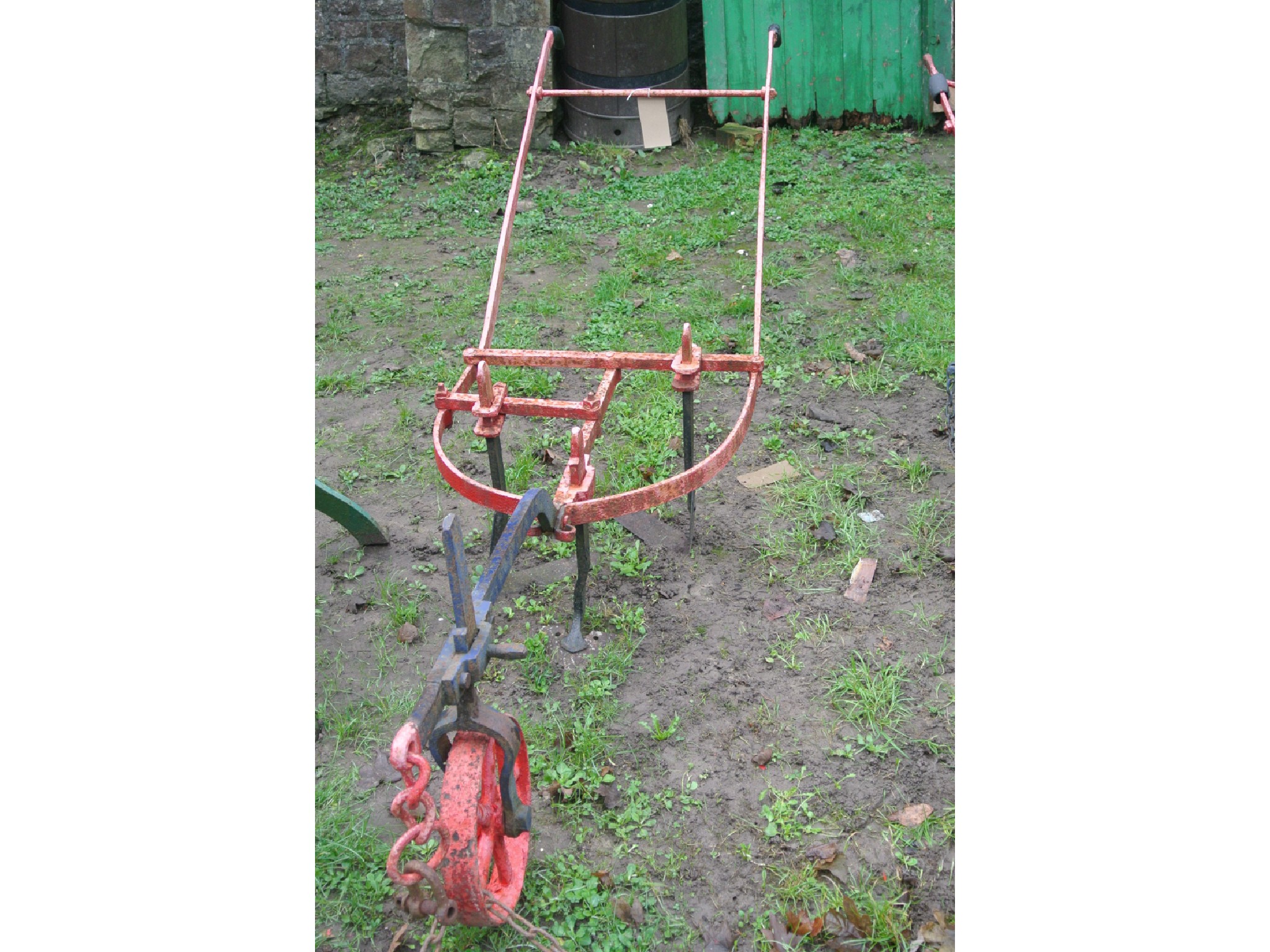 Appraisal: A Victorian single furrow three-bladed horse-drawn plough the cast iron