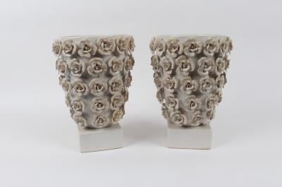 Appraisal: A pair of white glazed planters each decorated with applied