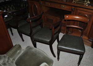 Appraisal: Four th century mahogany standard dining chairs with tralfalgar backs