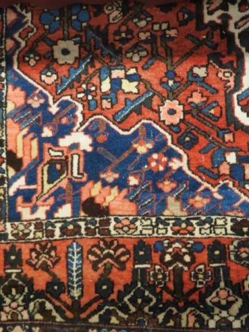 Appraisal: Bakhteiari Persian Handmade Room Size Rug primarily reds blue ivorys