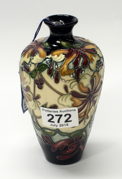 Appraisal: Moorcroft vase decorated in the Honeysuckle design height cm Graded