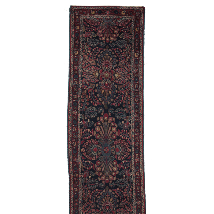 Appraisal: Persian runner c floral design with a red border minor