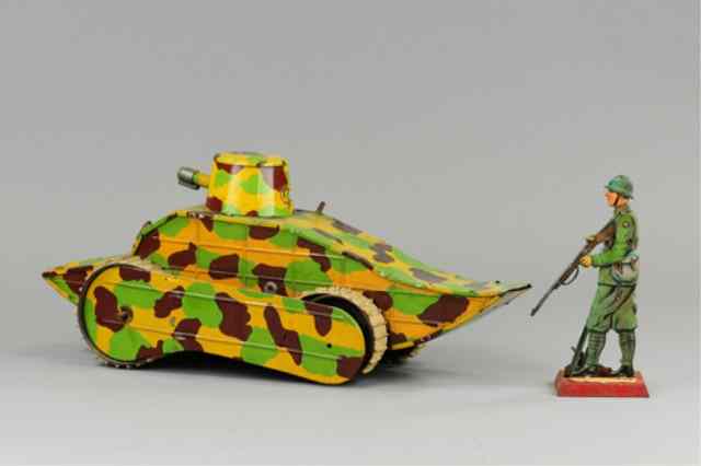 Appraisal: MILITARY TANK AND SOLDIER Large scale lithographed tin tank camouflaged