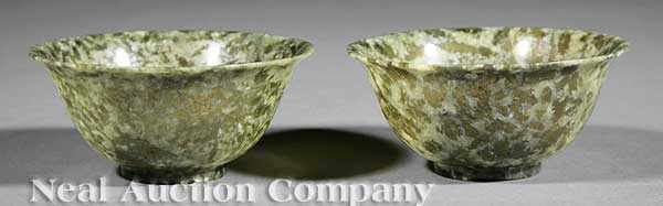 Appraisal: A Pair of Chinese Carved Mottled Green Bowls thin sides