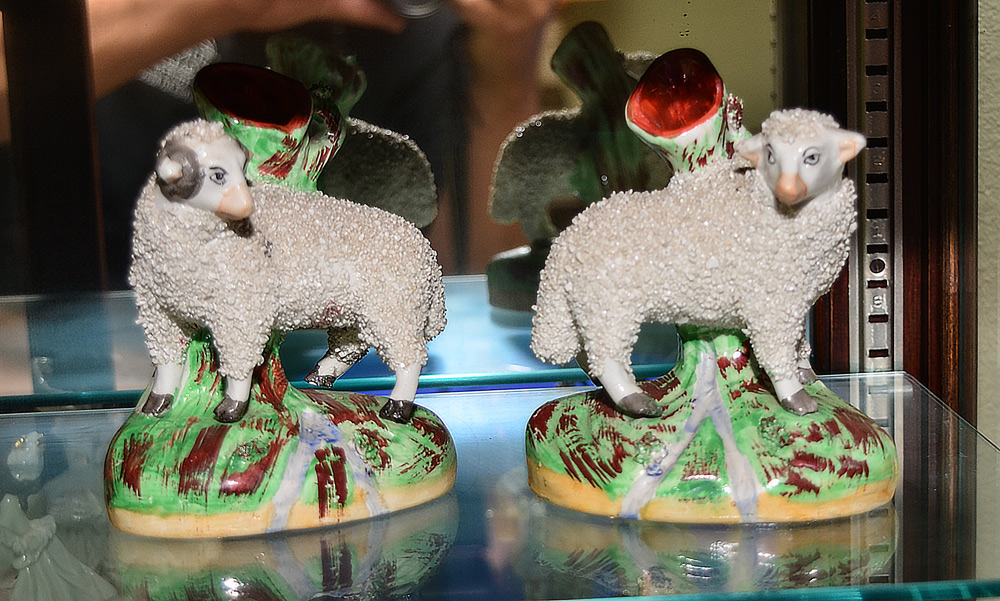 Appraisal: PAIR STAFFORDSHIRE SHEEP SPILL VASES Ram and ewe polychrome decorated