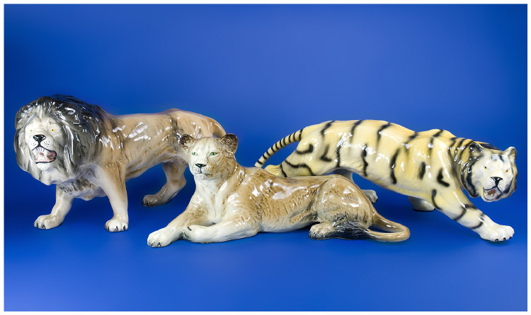 Appraisal: Three Realistically Modelled Animal Figures Lion Lioness And A Tiger