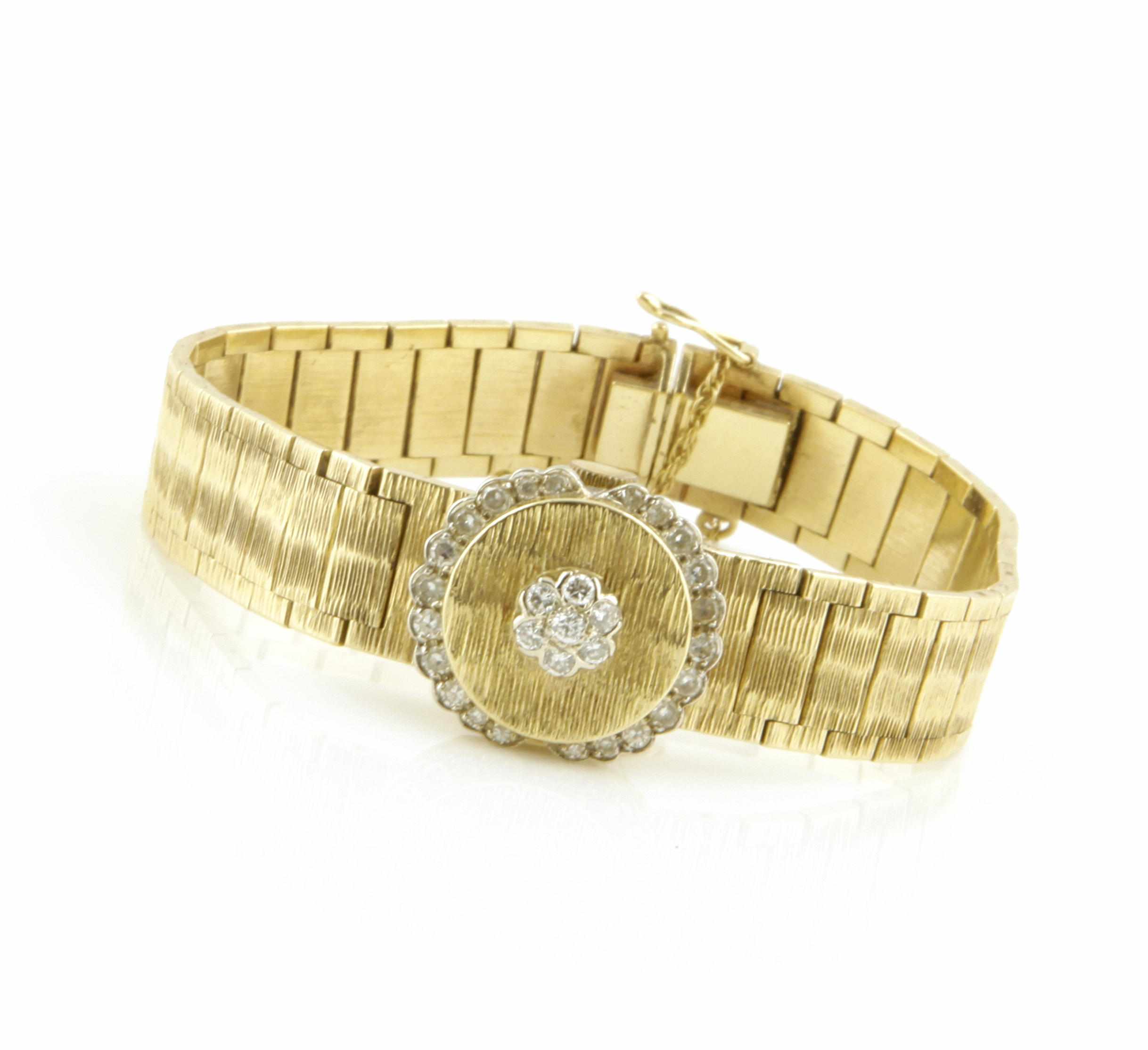 Appraisal: A diamond and k bicolor gold covered dial bracelet wristwatch