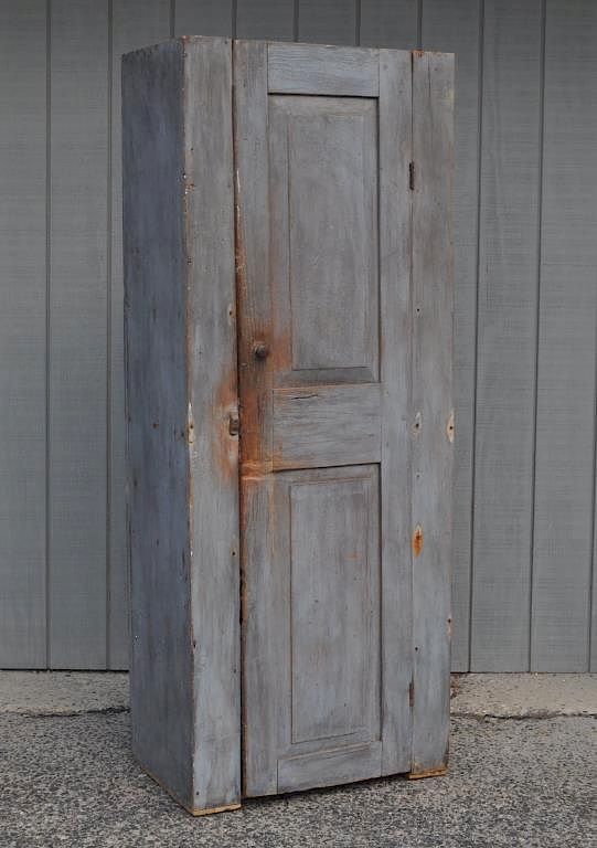 Appraisal: American Country Blue Painted Chimney Cupboard with red interior door