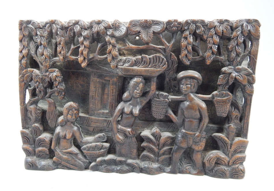 Appraisal: An Eastern carved wooden wall plaque decorated with figures working