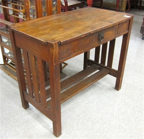 Appraisal: ARTS CRAFTS OAK LIBRARY TABLE American c having a rectangular