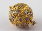 Appraisal: An carat gold pave set diamond ball shape necklace clasp