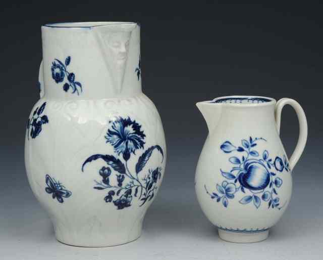 Appraisal: A WORCESTER UNDERGLAZE BLUE MASK JUG with raised leaf decoration