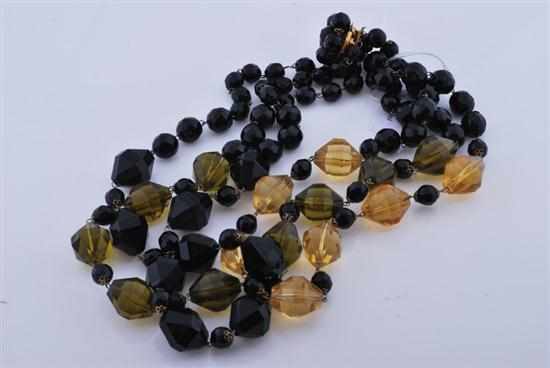 Appraisal: A TRIPLE STRAND OF BEADS BLACK FRENCH JET AND YELLOW