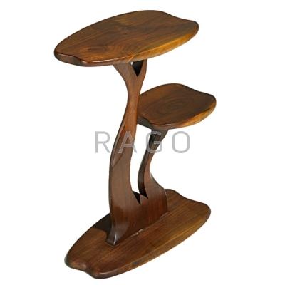 Appraisal: ROBERT WHITLEY b Tiered sculpted walnut side table Solebury PA