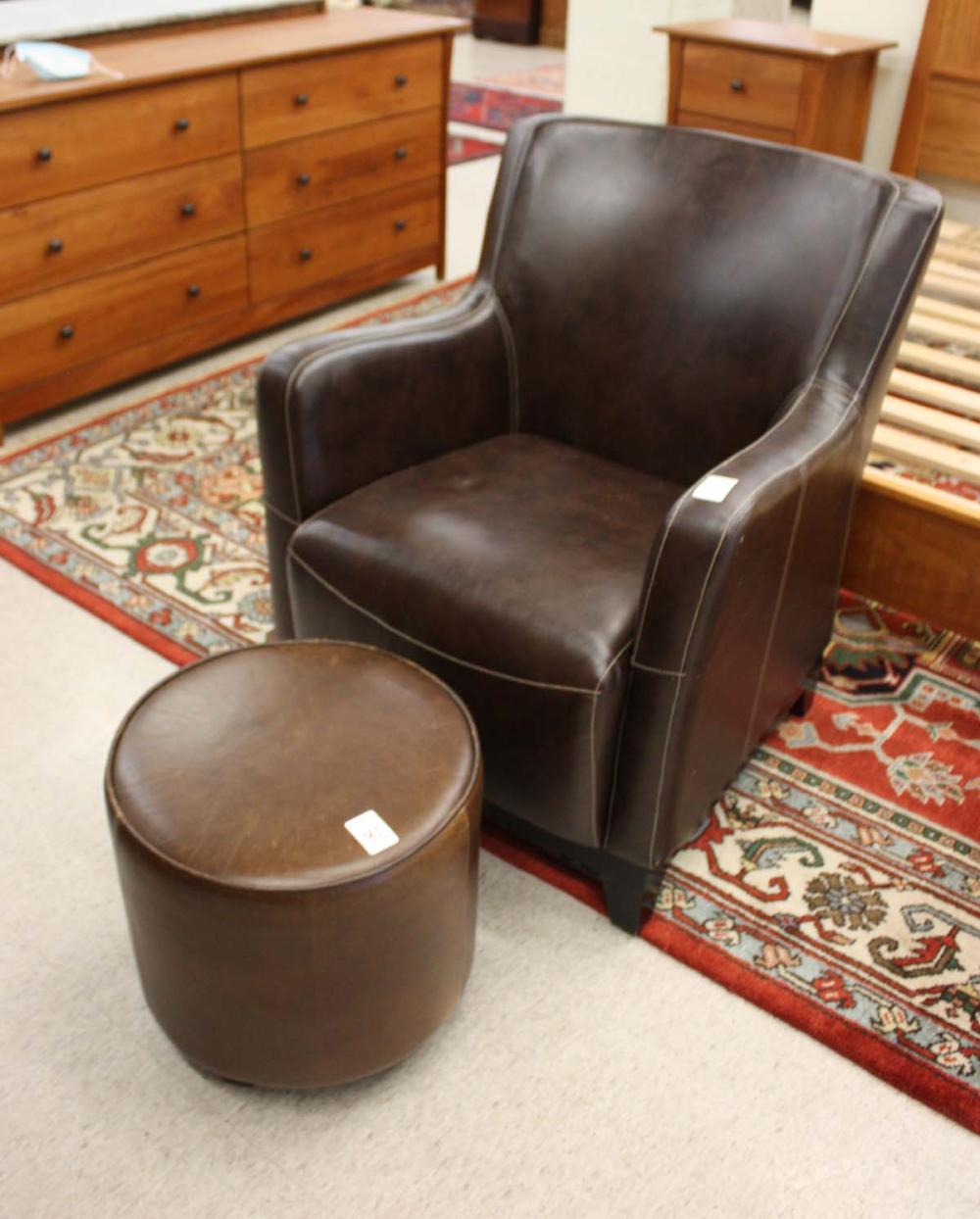 Appraisal: CONTEMPORARY LEATHER ARMCHAIR AND OTTOMAN both having dark brown leather