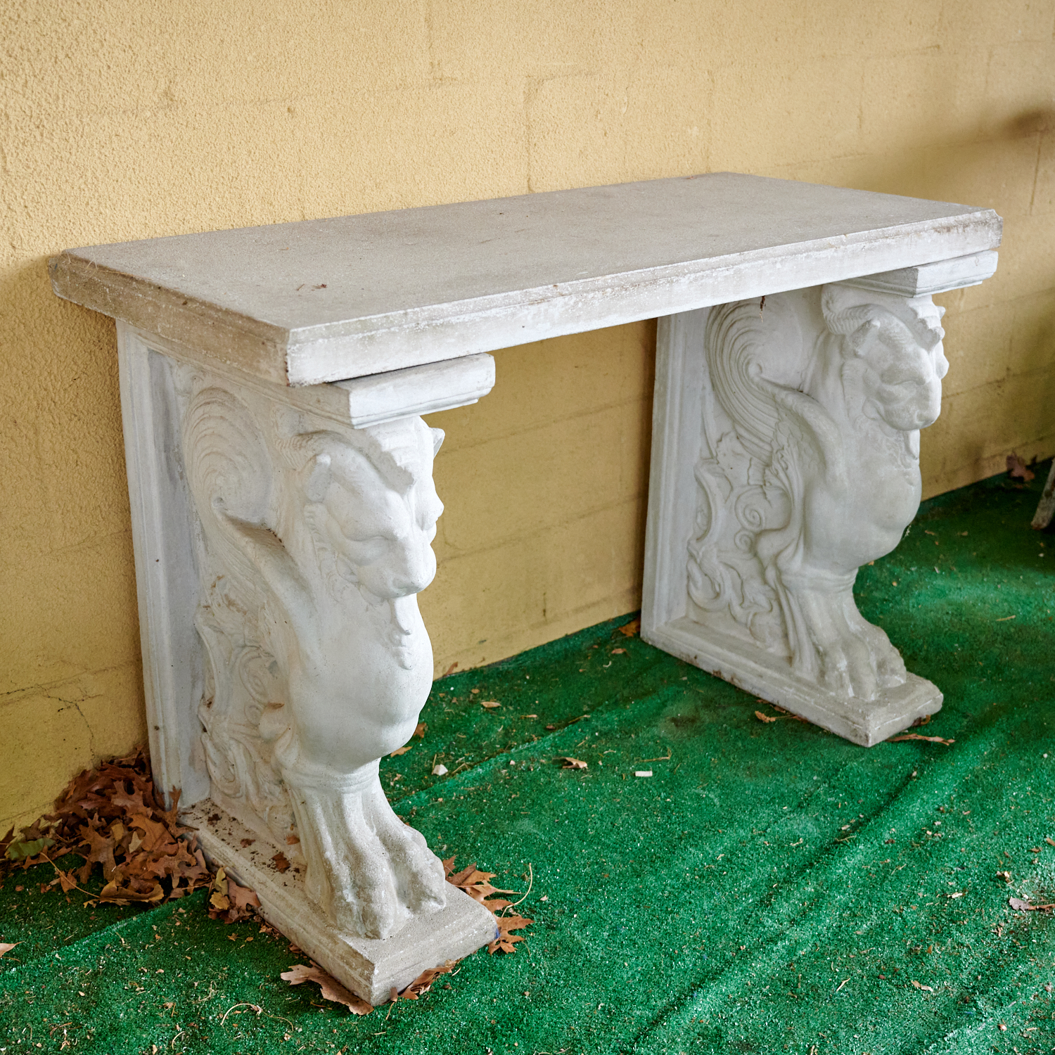 Appraisal: NEOCLASSICAL STYLE CAST STONE GRIFFIN CONSOLE th c rectangular top