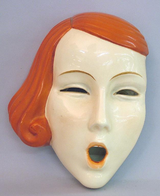 Appraisal: Czechoslovakian 's wall mask modelled as a girl screaming printed