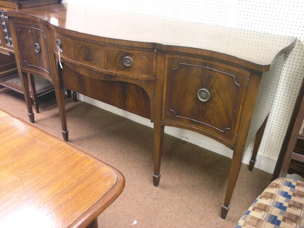 Appraisal: A George III-style mahogany serpentine-fronted sideboard inlaid with boxwood stringing