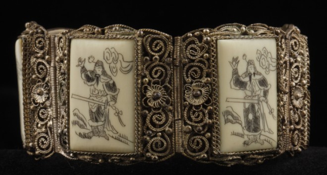 Appraisal: Four panel scrimshaw design on silver long S