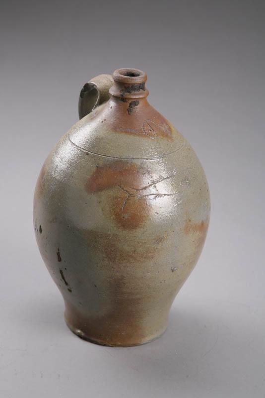 Appraisal: STONEWARE JUG New England early th century Ovoid form with