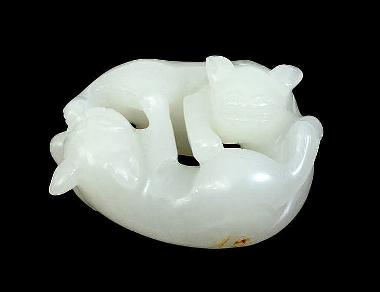 Appraisal: CHINESE WHITE JADE STUDY OF TWO CONJOINED RECUMBENT CATSWith intricate