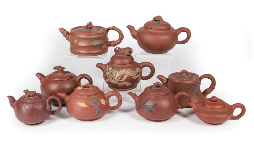 Appraisal: Nine Chinese Yixing Pottery Teapots th c variously marked h