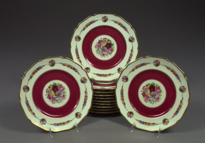 Appraisal: Set of Twelve Hutschenreuter Bavaria Claret-Bordered and Floral-Polychromed Ivory Porcelain