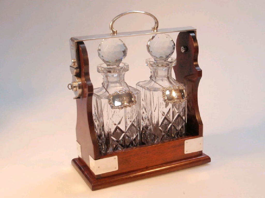 Appraisal: A modern mahogany and electroplate mounted Tantalus with two square