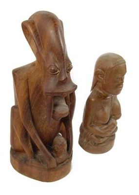 Appraisal: Two Malaysian carved groups 'The tooth spirit ' in cm