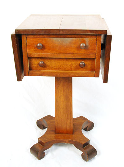 Appraisal: An Empire Two-drawer Work Stand mahogany and walnut with wood