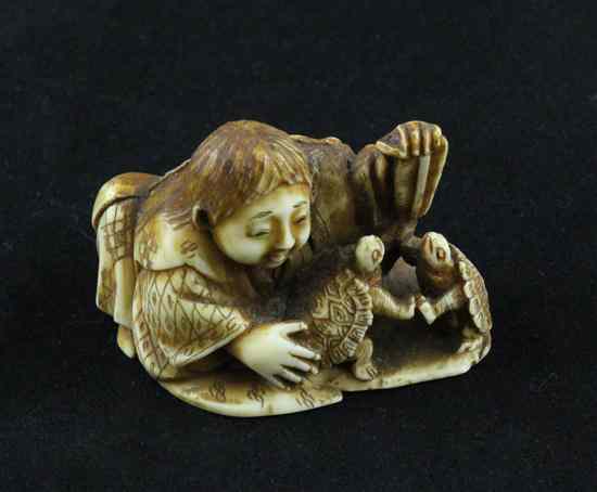 Appraisal: A small Meiji period ivory okimono carved as a boy