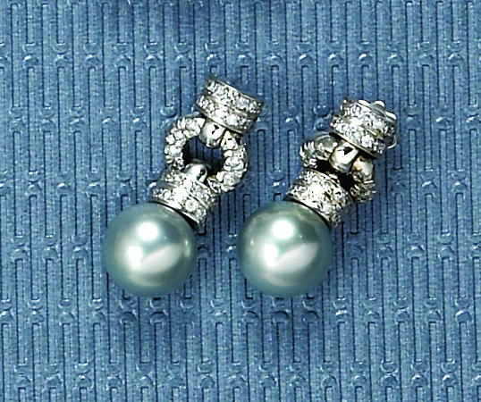 Appraisal: PEARL AND DIAMOND EARRINGS k white gold dangling pierced earrings