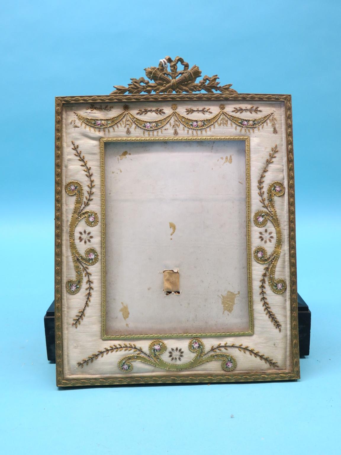 Appraisal: A th century French picture frame gilt-scroll design with ribbon