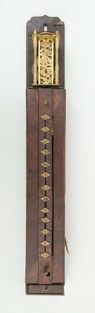 Appraisal: JAPANESE BRASS-MOUNTED ASH BOARD CLOCK The trunk with movable indicator