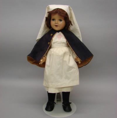 Appraisal: Unmarked composition nurse doll Blue sleep eyes open mouth brown