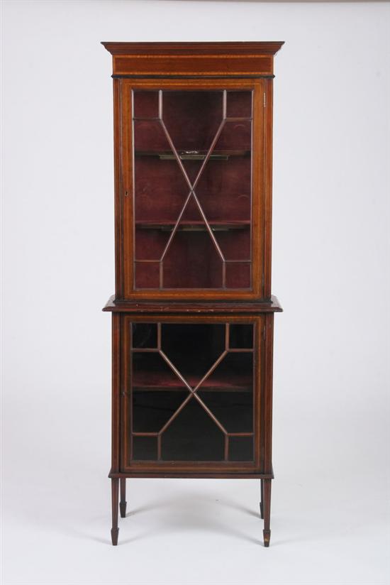 Appraisal: GEORGIAN STYLE MAHOGANY STEP-BACK VITRINE early th century Projecting molded-edge