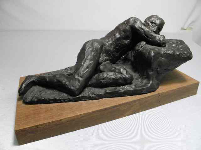 Appraisal: Bronze finish clay sculpture of a male nude reclining Signed