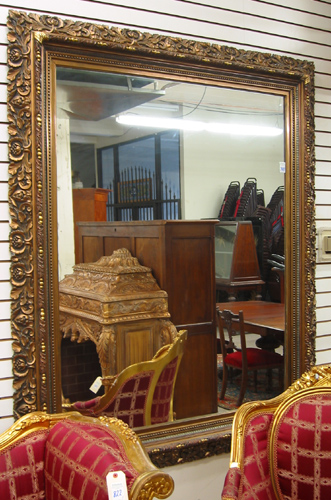 Appraisal: A LARGE RECTANGULAR GILT WOOD WALL MIRROR from the 's-