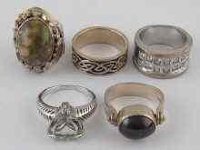 Appraisal: A mixed lot comprising five white metal test silver rings