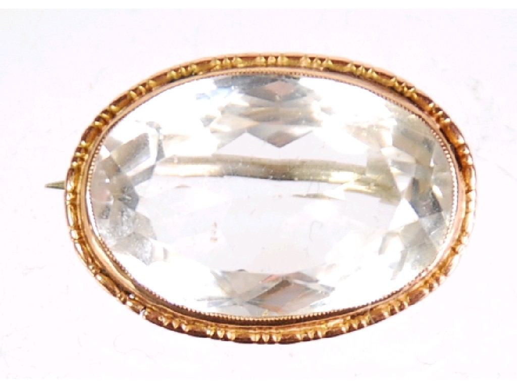 Appraisal: FACETED OVAL ROCK CRYSTAL BROOCH in ct gold frame with