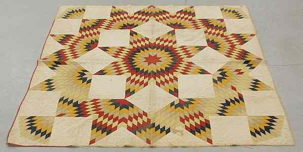 Appraisal: Two quilts- Pennsylvania star quilt 'x c and a pieced