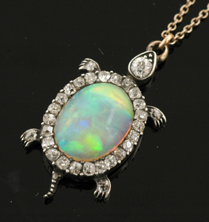 Appraisal: An Antique opal and diamond tortoise pendant Centrally set with